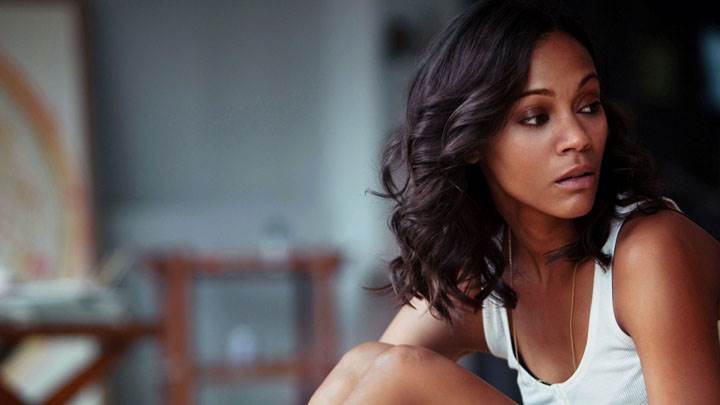Zoe Saldana Sitting Pose In White Top